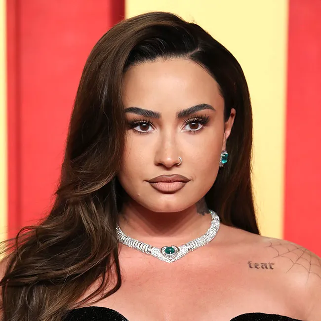 Demi Lovato shines at Vanity Fair Oscar Party in glamorous attire.