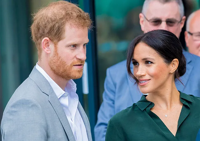 Meghan Markle looks at Prince Harry with admiration