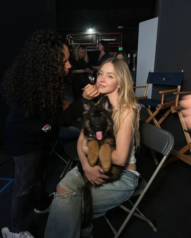 Sydney Sweeney and her dog on set