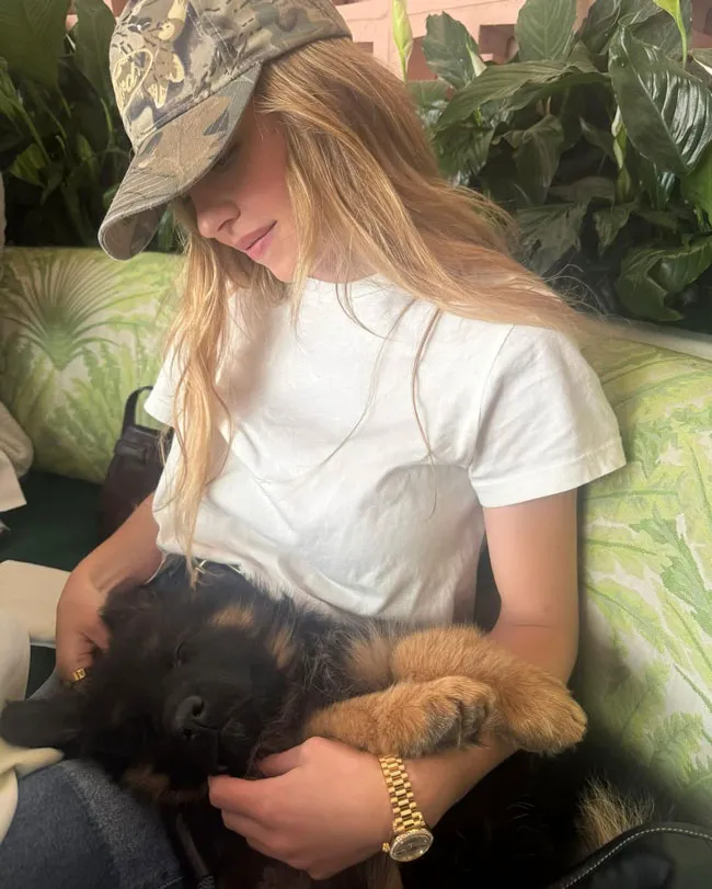 Sydney Sweeney snuggling her new puppy