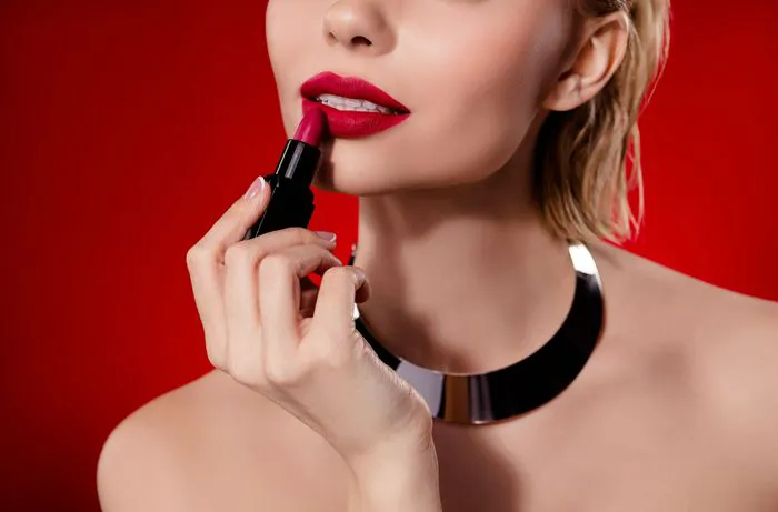 "Woman applying eyeliner in a beauty tutorial"