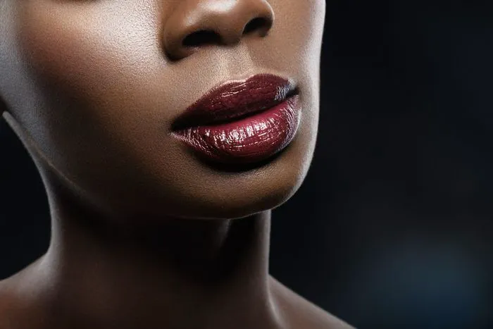 "Close-up of a middle-aged woman touching her face"