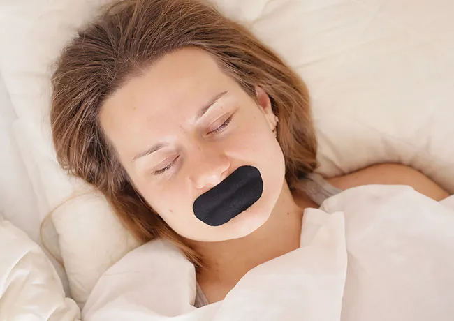 woman-wearing-mouth-tape