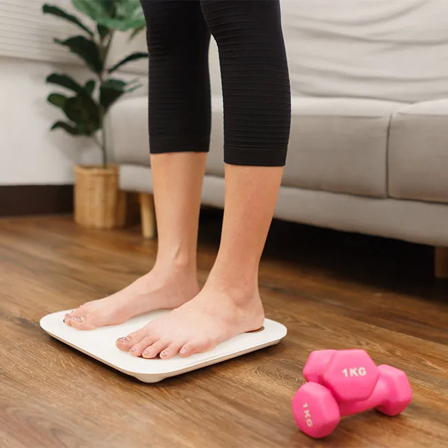 woman-standing-on-scale