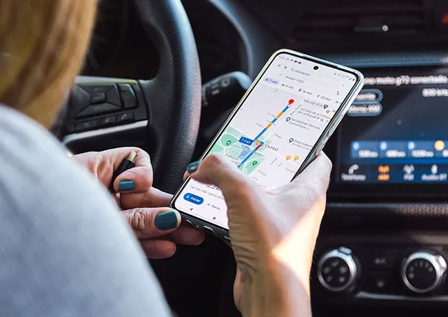 woman-using-google-maps-car