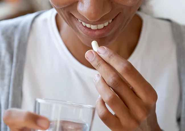 woman-taking-probiotic