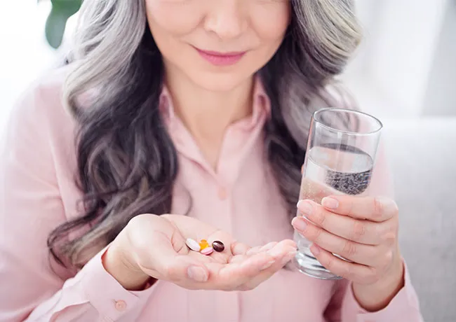 woman-taking-supplements