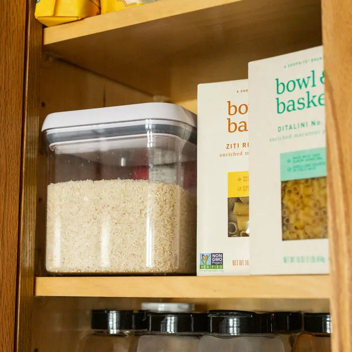 white rice and pasta in cabinet