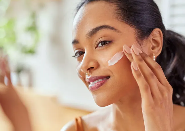 woman-moisturizing-skin