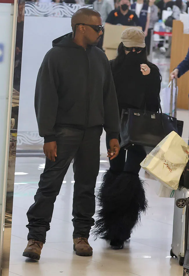 "Kanye West arriving in Seoul with wife Bianca Censori"