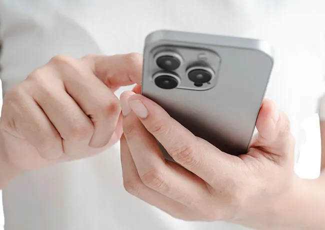 person-using-silver-iphone