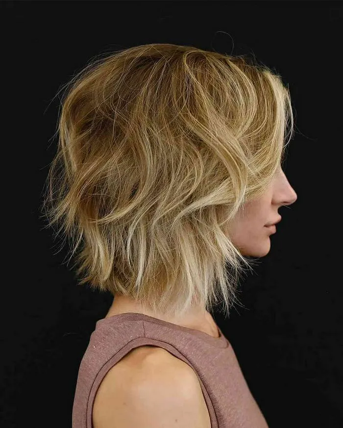 "Bob haircut with razor ends for a wispy look"