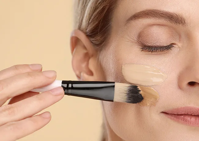 woman-using-foundation-brush