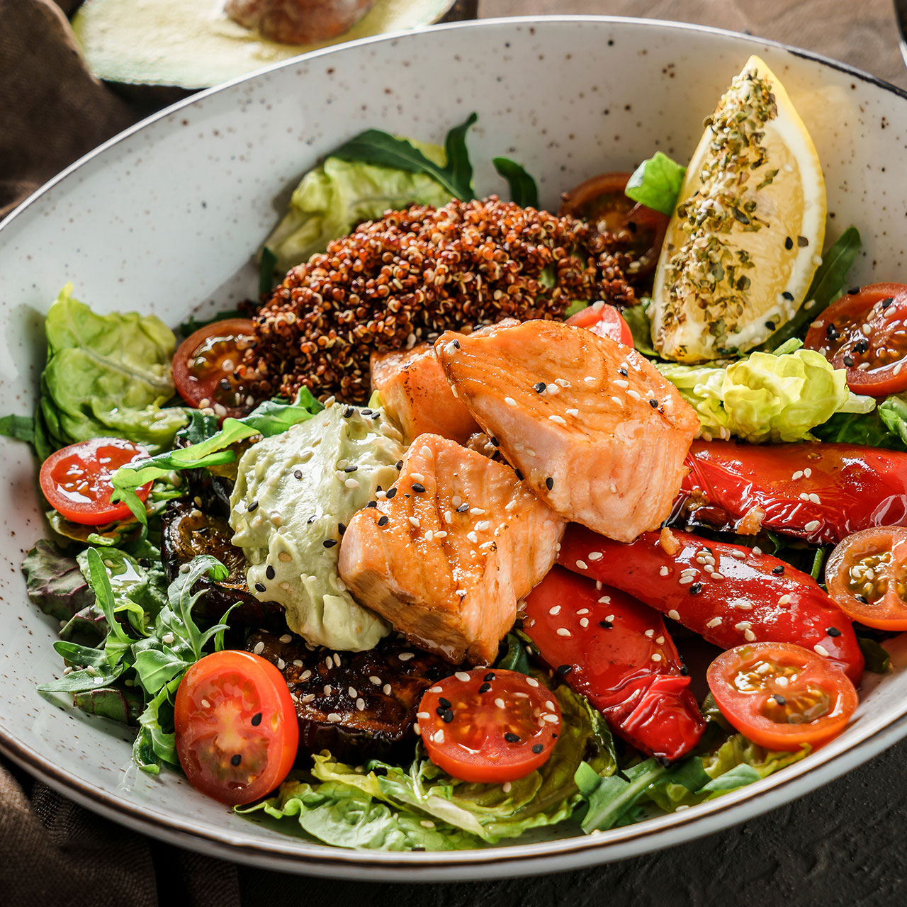 healthy salad with salmon quinoa and grilled veggies