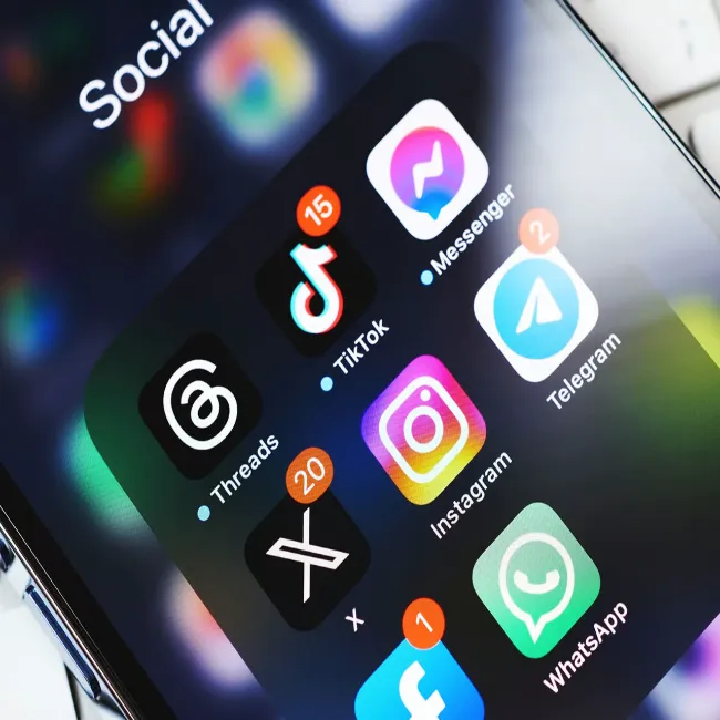 "Various social media apps displayed on an iPhone"