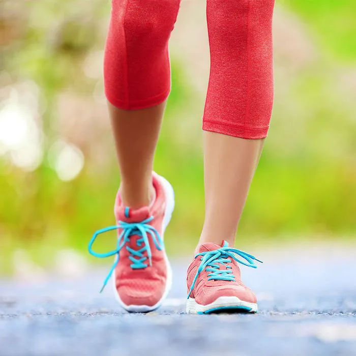 woman walking outside on path