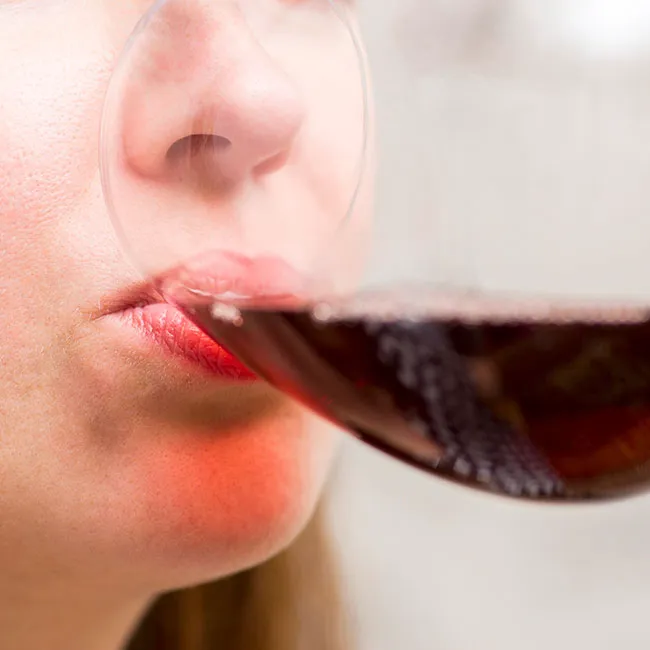 Closeup-of-woman-drinking-wine