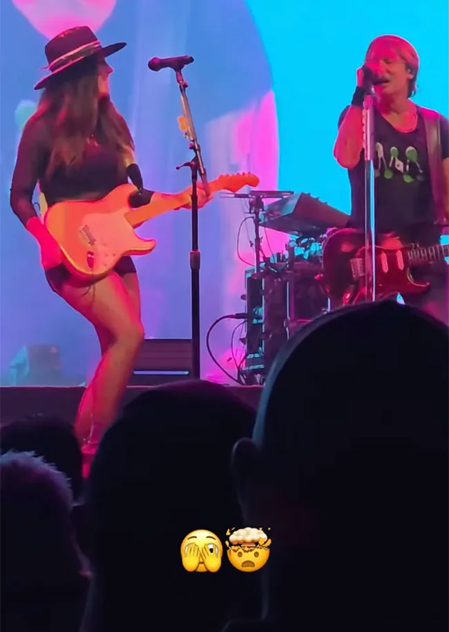 Keith Urban performing with Maggie Baugh