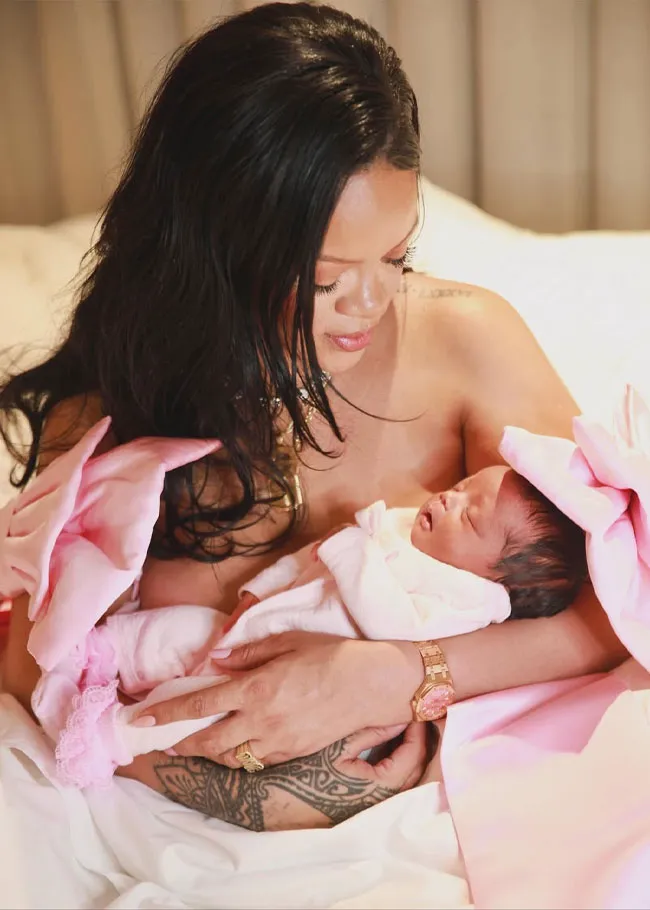 Rihanna holding newborn baby girl Rocki