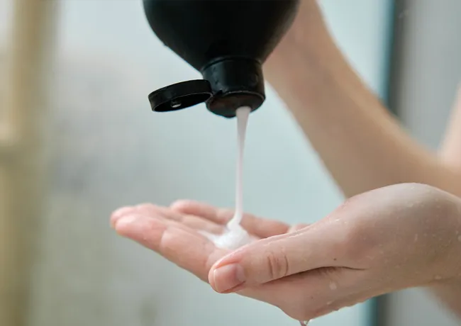 woman-pouring-out-shampoo