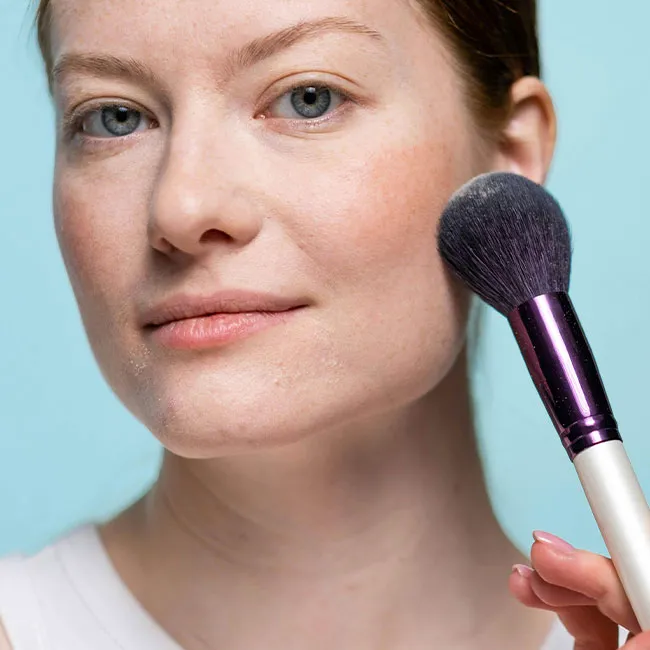 woman-applying-blush
