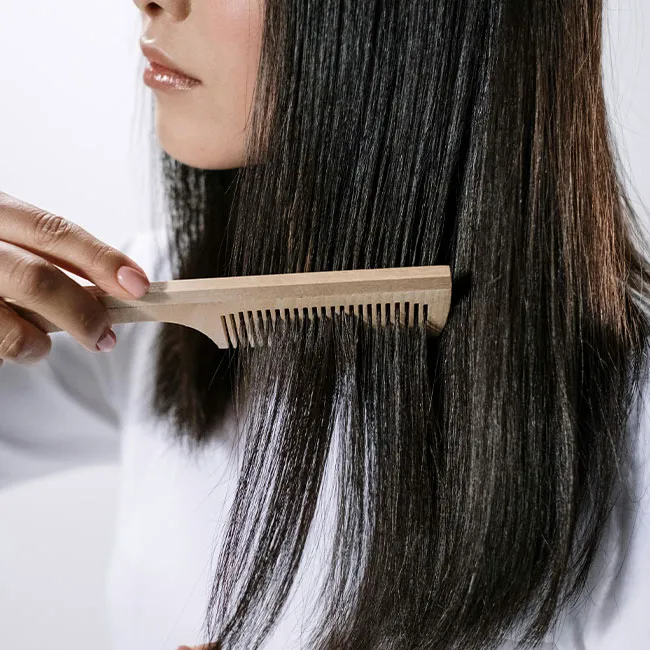 woman-combing-black-hair