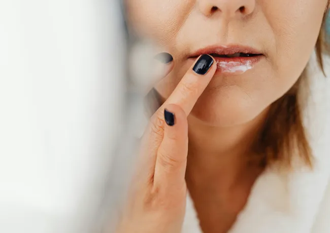 woman-prepping-lips-moisturizer