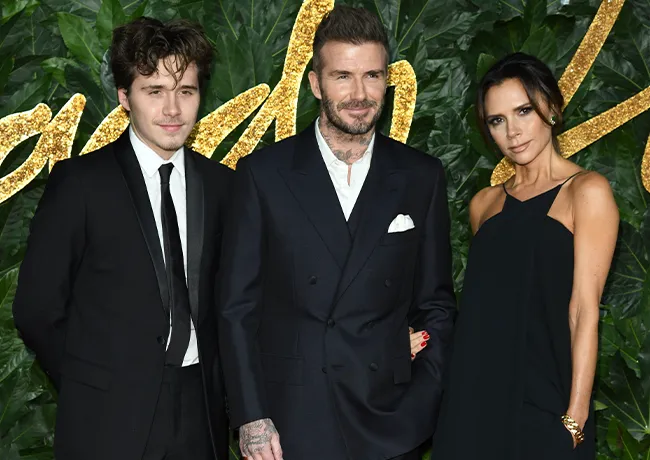 David Beckham and Victoria Beckham with Brooklyn Beckham at The Fashion Awards