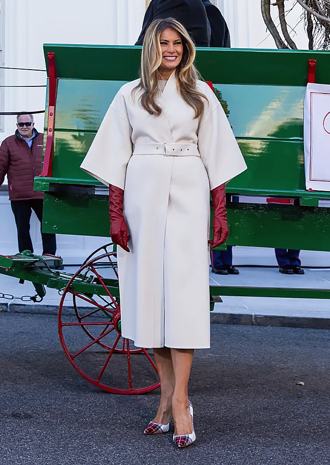 Melania Trump white coat red gloves White House Christmas tree ceremony 2025