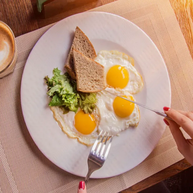 "Plate with eggs for breakfast"