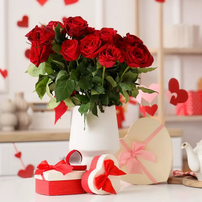 Roses and Valentine's Day gifts displayed on a countertop.