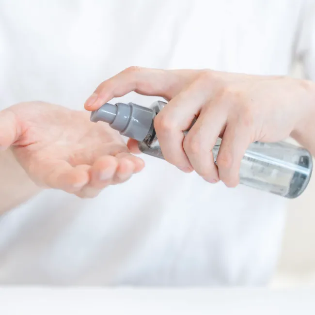 "Woman's hand with a skincare product"