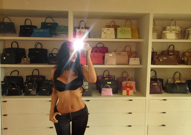 "Kylie Jenner posing in front of her Hermès collection on Instagram"