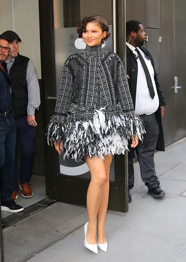 "Zendaya wearing a feathered dress outside Good Morning America"