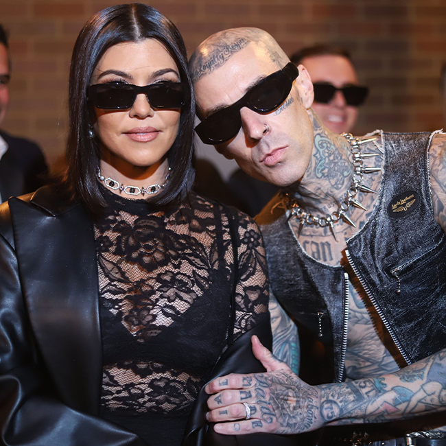 "Kourtney Kardashian and Travis Barker at a fashion show"