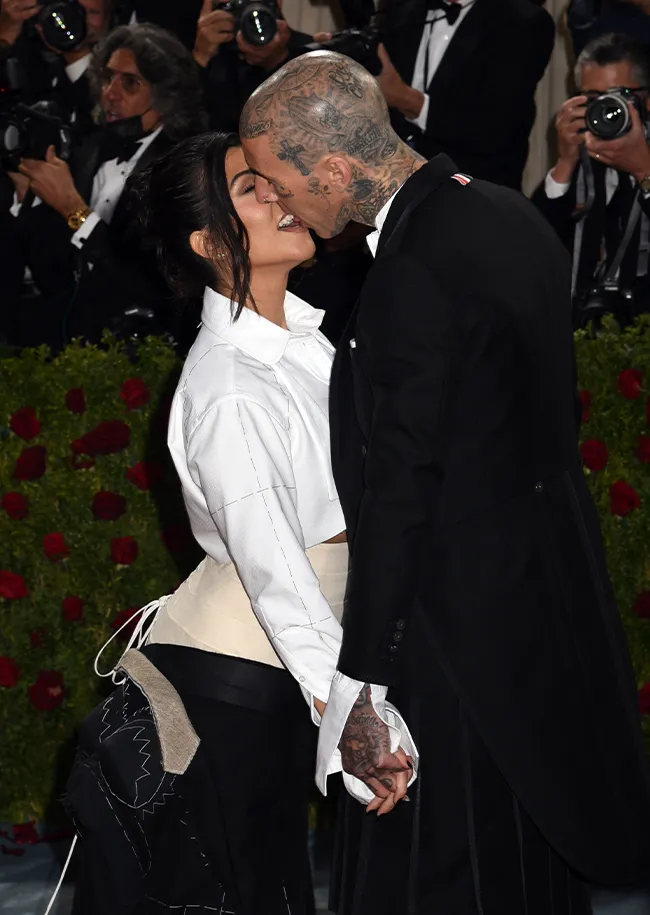 Kourtney Kardashian and Travis Barker kissing at Met Gala
