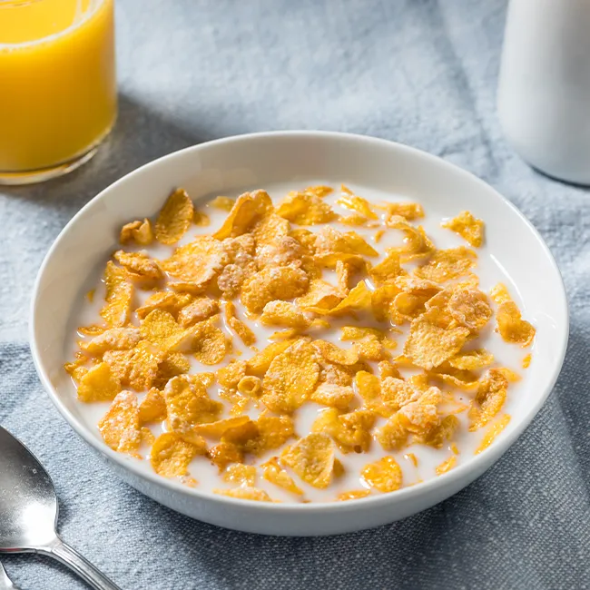 Colorful breakfast cereal in a bowl with milk
