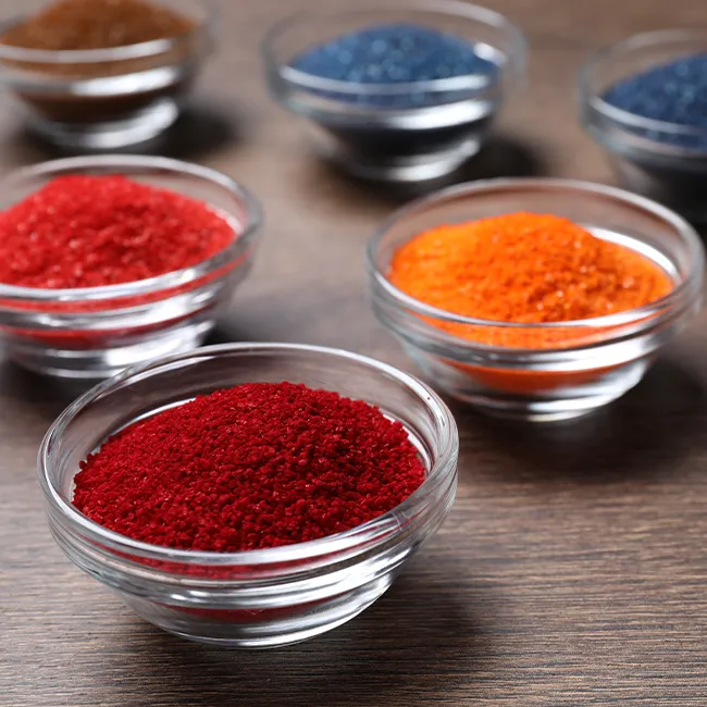 Colorful food dyes displayed for baking and cooking.