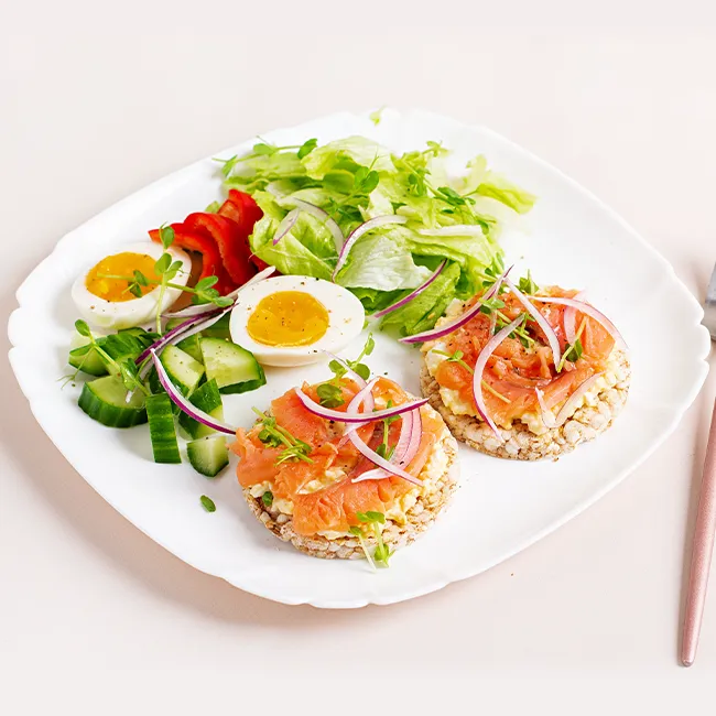 High-protein breakfast bowl with eggs and toppings.