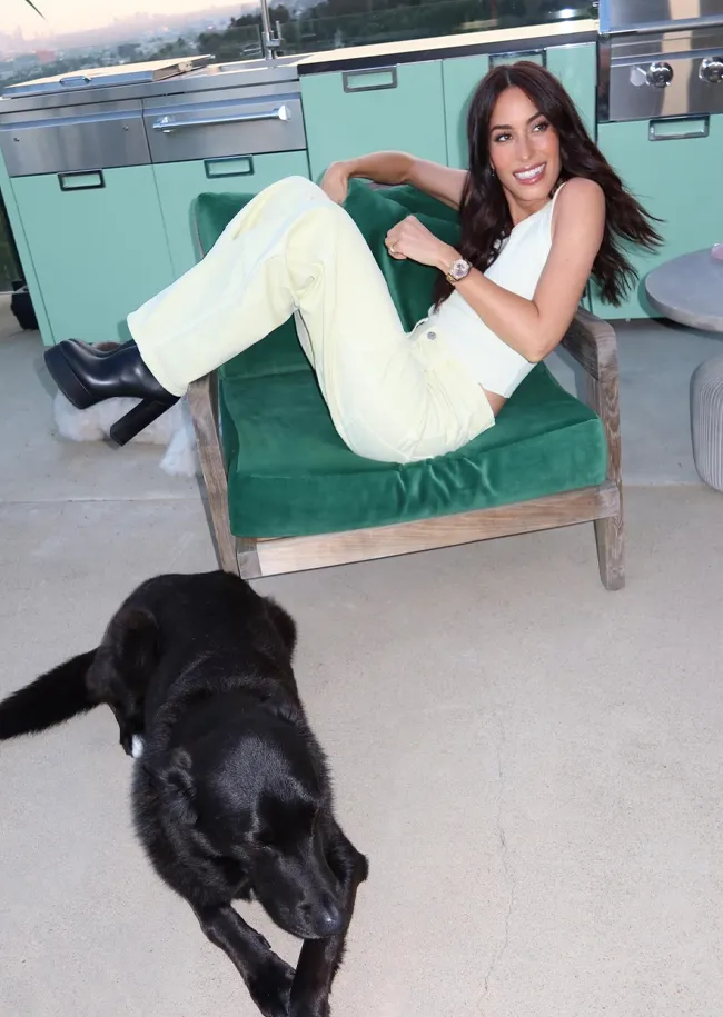 Ines de Ramon tank top and baggy cream pants Agolde event