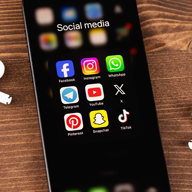 "iPhone with various social media apps"