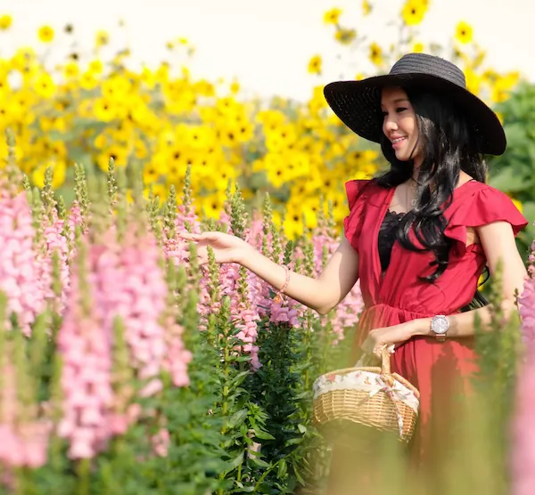 "Woman enjoying summer sun with a hat"