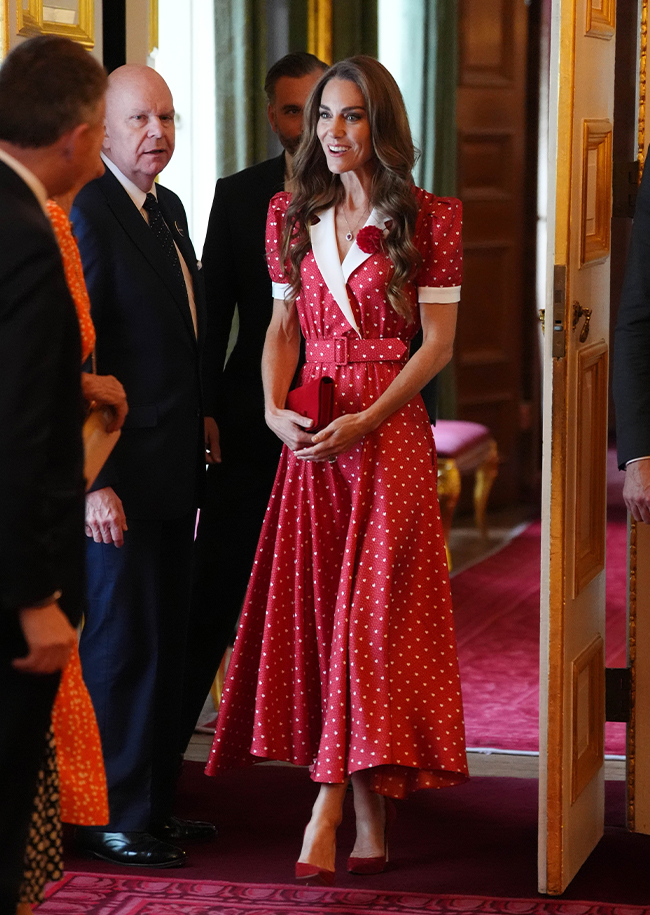 "Catherine, Princess of Wales, in a heart-printed red dress at a Cancer Research event"