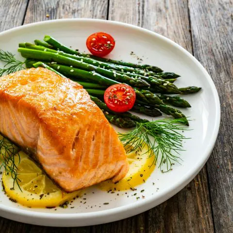 "Salmon dish served with kale"