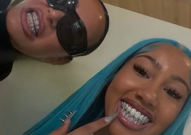 "Kim Kardashian and North West with matching diamond grills"