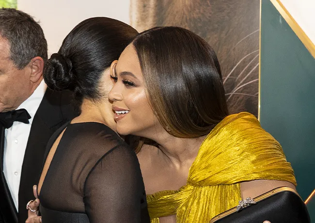 Beyonce and Meghan Markle hugging at The Lion King premiere